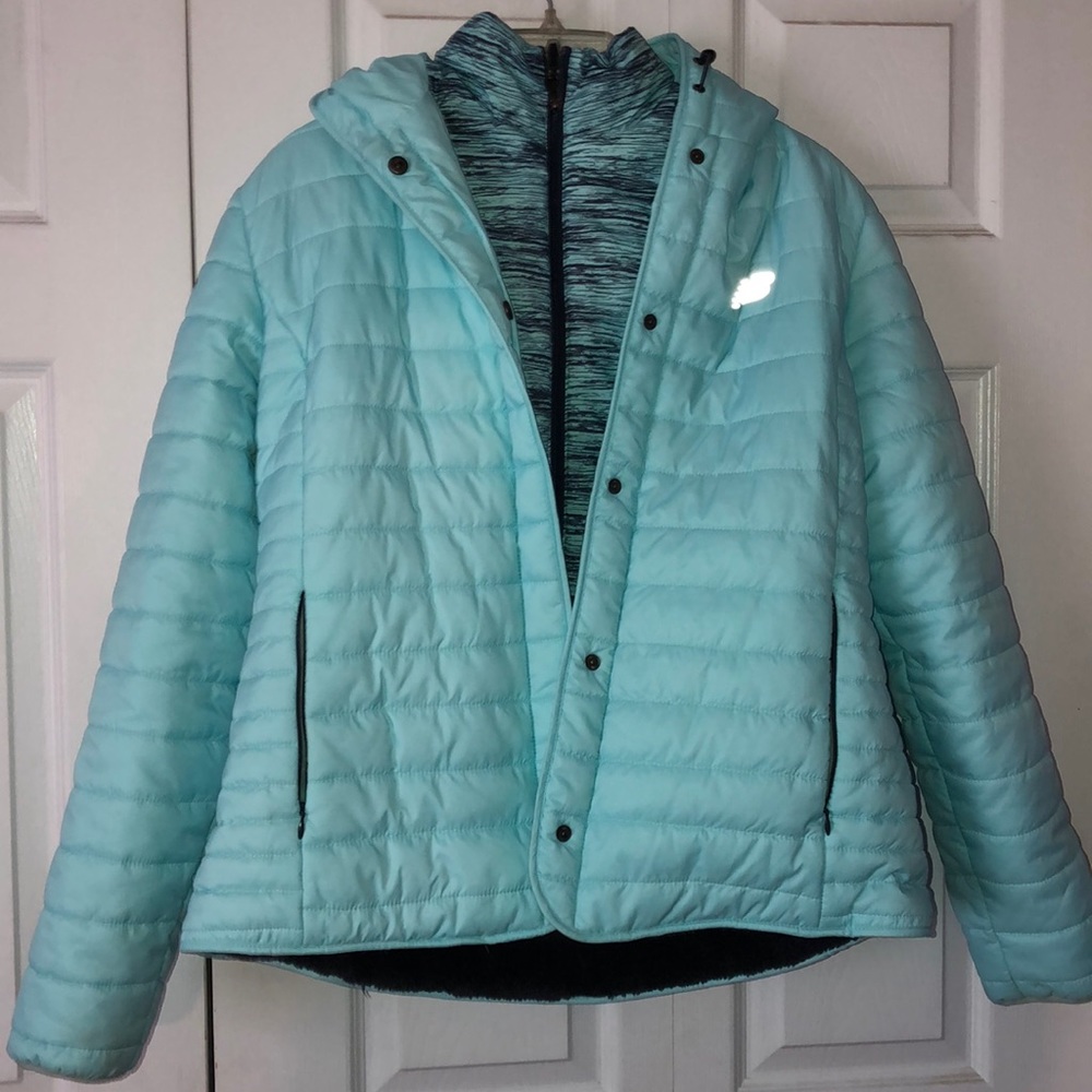 Double layer teal and black fuzzy jacket.